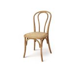 Natural wood bentwood chair with curved top backrest and slender legs, bohemian-style event seating.