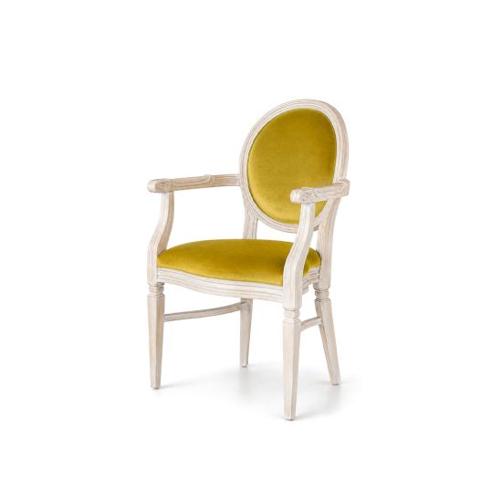 Chandelle armchair with ivory wooden frame and rich gold velvet fabric.