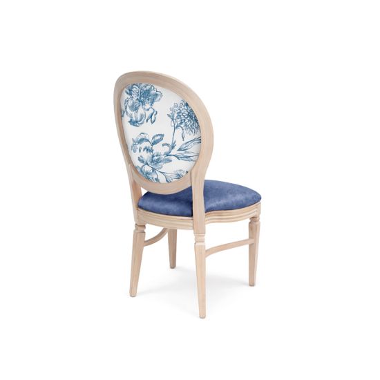 Natural wood dining chair with blue upholstered seat and oval backrest featuring blue floral pattern for elegant weddings and event seating