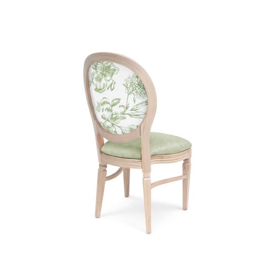 Natural wood dining chair with sage green upholstered seat and oval backrest featuring green floral pattern for elegant event seating