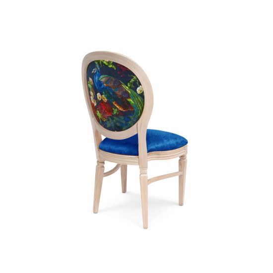 Natural wood dining chair with blue velvet seat and oval backrest featuring colorful peacock design for luxury event seating