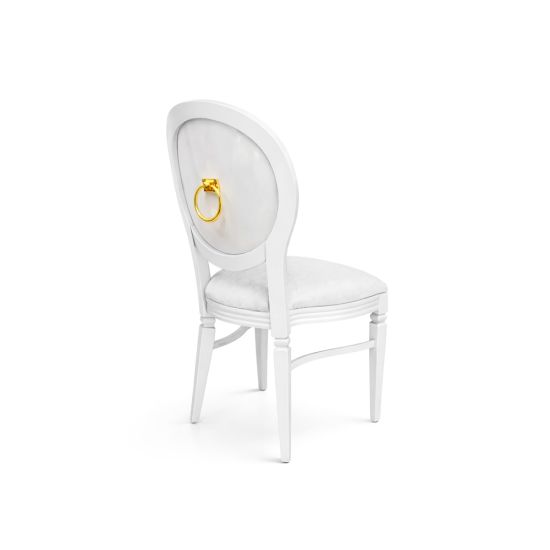 White Chandelle chair featuring an oval clear back with gold ring accent and a white upholstered seat, sleek vintage-style banquet chair for weddings and formal events