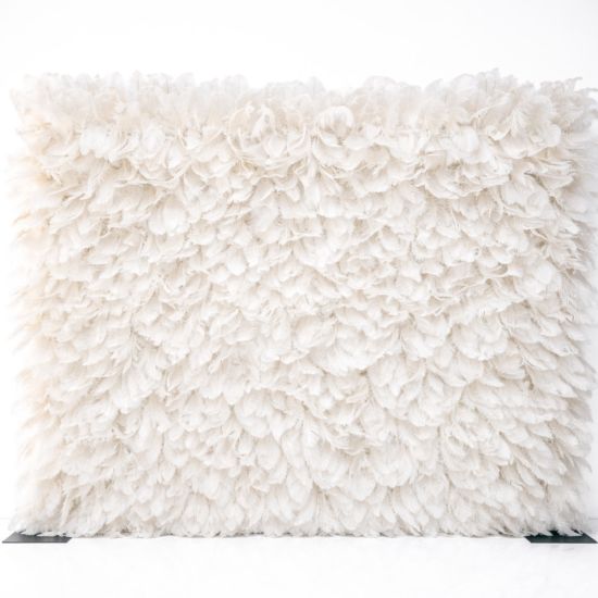 White feather-style plume wall backdrop with layered soft texture, elegant wedding photo backdrop panel for events and stages.