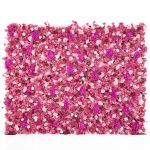 Bright fuchsia flower wall backdrop with dense mixed blooms, bold romantic photo backdrop panel for weddings and event décor styling.