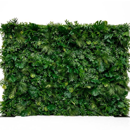 Dense tropical foliage wall backdrop with layered green leaves, botanical photo backdrop panel for events, lounges, and weddings.