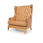 Empire loveseat in gold with tall wingback and button-tufted upholstery, statement lounge seating rental for weddings and events.