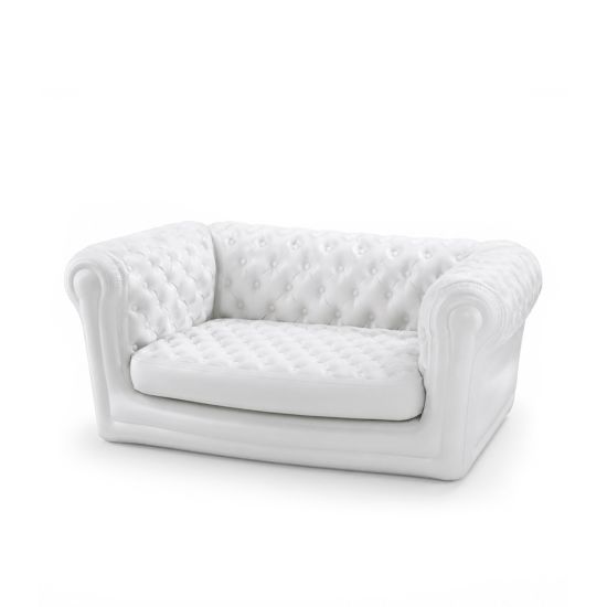 White inflatable sofa with tufted backrest, elegant lounge seating option for weddings, parties, and upscale event décor environments
