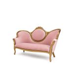 Pink Juliet sofa with ornate gold frame and curved back, romantic vintage lounge seating for weddings, photo ops, and events