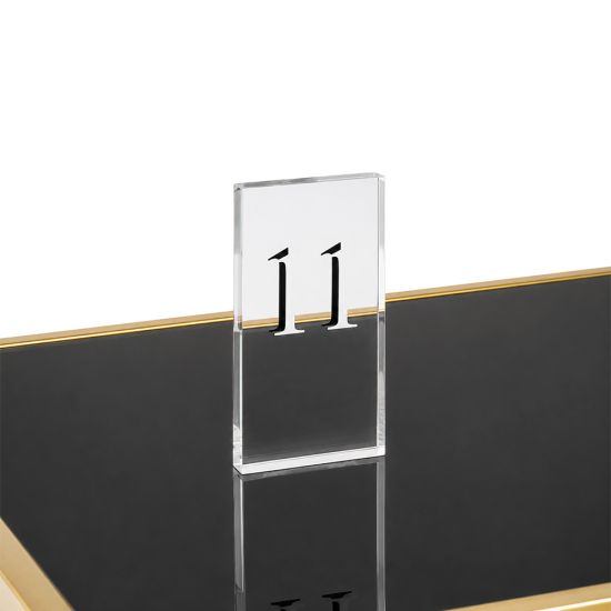 Clear acrylic etched table number holder with rectangular stand, ideal for displaying seating numbers at weddings and banquets