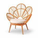 Plumage chair with fan-shaped rattan back and white cushion, boho statement seating rental for weddings and event lounges.