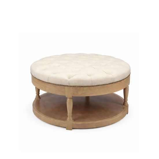 Round vintage ottoman with natural wood base, tufted white upholstered top and lower shelf, elegant lounge seating for weddings and events.