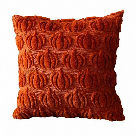 Rust orange textured throw pillow with raised oval pattern, cozy autumn accent cushion for fall events and lounge décor styling.