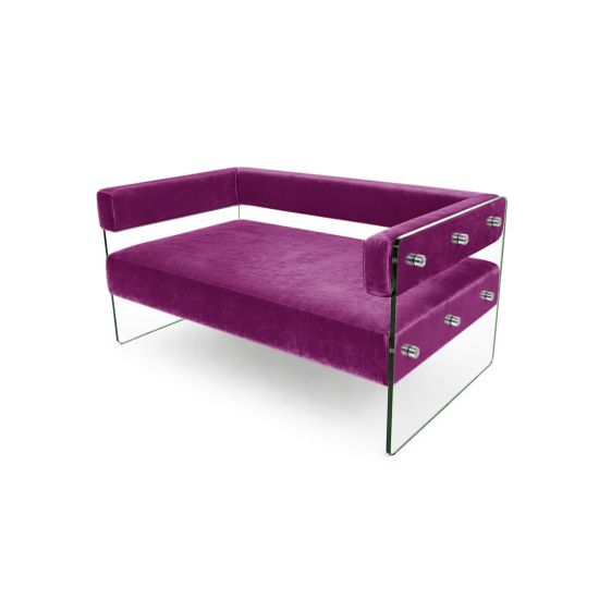 Modern Magenta velvet loveseat with clear glass side panels and low backrest, contemporary crystal sofa seating for upscale event lounges.