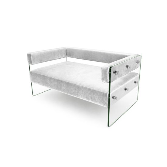 Modern White velvet loveseat with clear glass side panels and low backrest, contemporary crystal sofa seating for upscale event lounges.