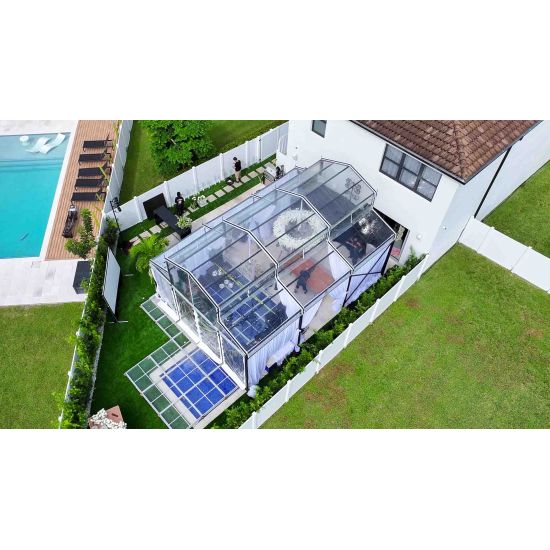 20′x60′ cathedral structure tent with black frame and clear top canopy for elegant outdoor events and garden weddings