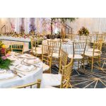 Gold resin Chiavari chair with Light Pink  cushion seat, spindled high back and slim four-leg frame, elegant event seating