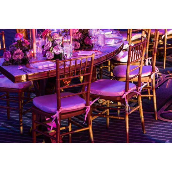 Gold resin Chiavari chair with Light Pink  cushion seat, spindled high back and slim four-leg frame, elegant event seating