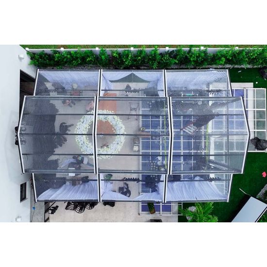 20′x60′ cathedral structure tent with black frame and clear top canopy for elegant outdoor events and garden weddings