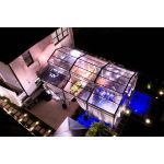 20′x60′ cathedral structure tent with black frame and clear top canopy for elegant outdoor events and garden weddings