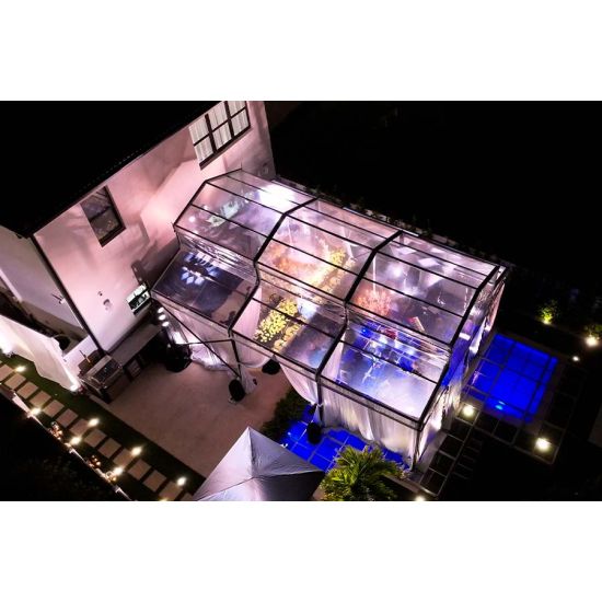 20′x60′ cathedral structure tent with black frame and clear top canopy for elegant outdoor events and garden weddings