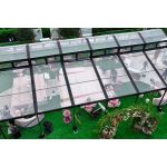 30′x100′ cathedral tent with black frame and clear top for elegant outdoor weddings and upscale events