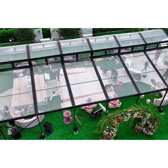 30′x100′ cathedral tent with black frame and clear top for elegant outdoor weddings and upscale events
