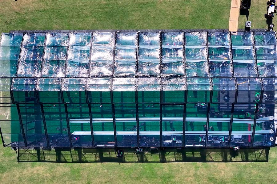 Top-down aerial view of a clear-span tent structure layout showing interior flooring and production equipment.