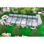 30′x100′ cathedral tent with black frame and clear top for elegant outdoor weddings and upscale events