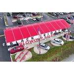 40'x90' curved event tent with black frame and red arched roof, open-sided modern structure displayed in product rendering with visible support beams