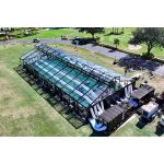 Trailer-mounted industrial air conditioner with multiple vent ports, 25–60 ton event cooling rental priced per square foot for large venues.