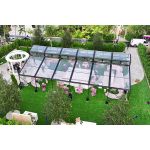 30′x100′ cathedral tent with black frame and clear top for elegant outdoor weddings and upscale events