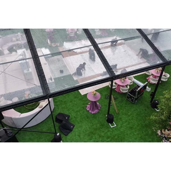 30′x100′ cathedral tent with black frame and clear top for elegant outdoor weddings and upscale events
