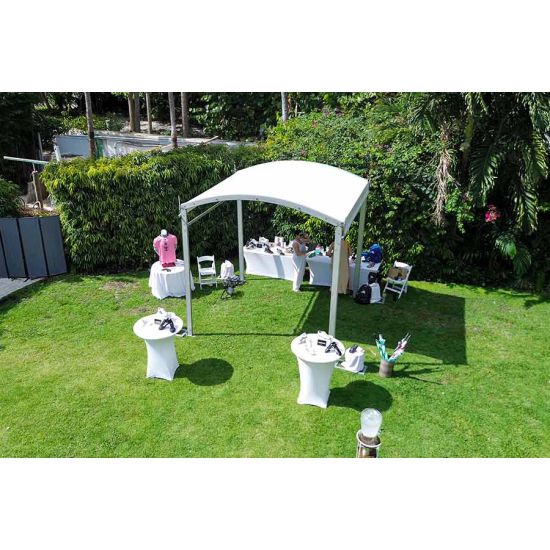 10'x80' curved event tent with silver frame and white arched roof, modern structure for outdoor events and rental setups