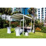 10'x80' curved event tent with silver frame and white arched roof, modern structure for outdoor events and rental setups