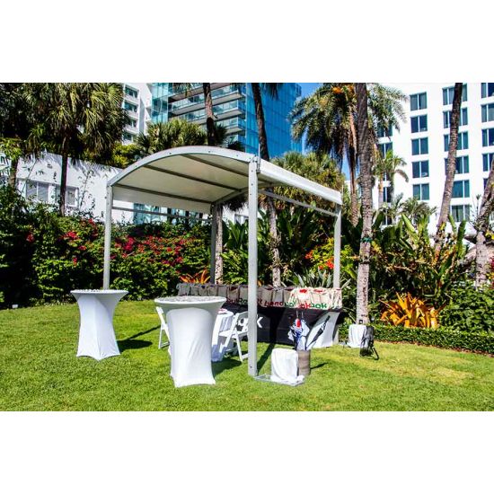 10'x80' curved event tent with silver frame and white arched roof, modern structure for outdoor events and rental setups