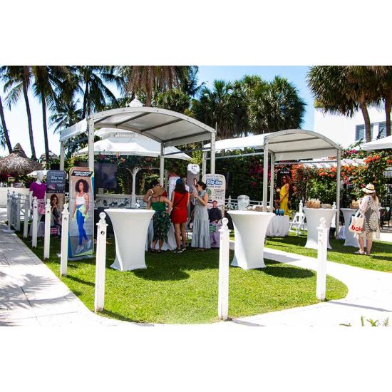 10'x80' curved event tent with silver frame and white arched roof, modern structure for outdoor events and rental setups