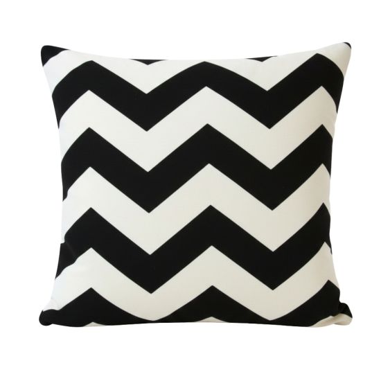 Black and white chevron throw pillow with bold zigzag pattern, modern graphic accent cushion for event lounges and décor styling.