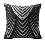 Black and silver throw pillow with art deco fan and chevron pattern, bold glam accent cushion for modern lounge décor styling.