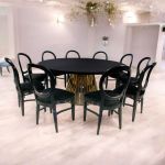 “72″ round Bohemian dining table with black wood top and matching gold base, ideal for modern event dining and reception décor.