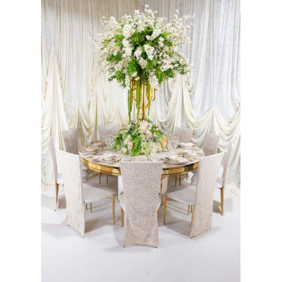 Ivory high-back event chairs with gold legs, featuring embroidered lace and smooth fabric covers with ivory cushioned seats for elegant wedding décor.