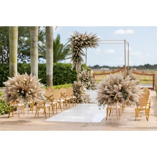 Gold oval-back event chair with polished metal frame and Gold upholstered seat, modern luxury seating ideal for weddings and upscale receptions.