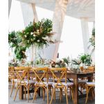 “Natural wood cross-back chair with natural jute cushion, X-shaped backrest and rustic-elegant event guest seating”