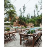 “Natural wood rustic bistro chair with curved slatted backrest and smooth wooden seat, stylish café-style event seating”