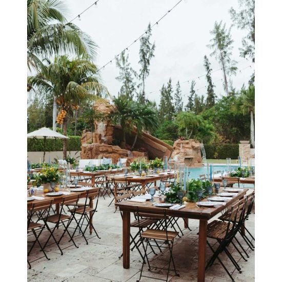 “Natural wood rustic bistro chair with curved slatted backrest and smooth wooden seat, stylish café-style event seating”