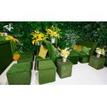 Lush green artificial living wall with mixed foliage and textured greenery, botanical backdrop panel for weddings, photo ops, and events.