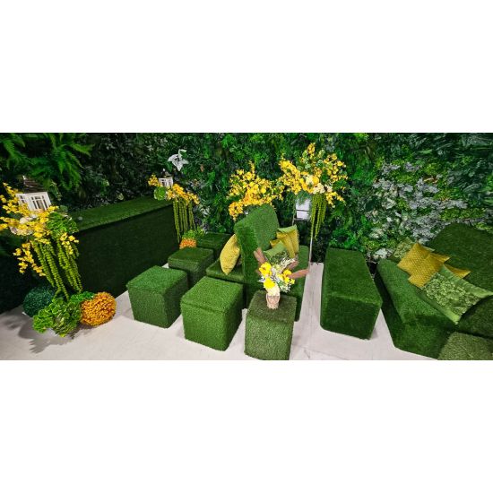 Lush green artificial living wall with mixed foliage and textured greenery, botanical backdrop panel for weddings, photo ops, and events.