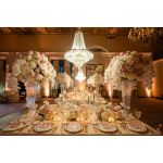 Chandelier hanger and coupler stand wrapped in greenery garland, curved support for hanging chandeliers or floral décor.