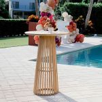 Natural wood Bohemian cocktail table with round top and warm finish, perfectly suited for relaxed event lounge décor”