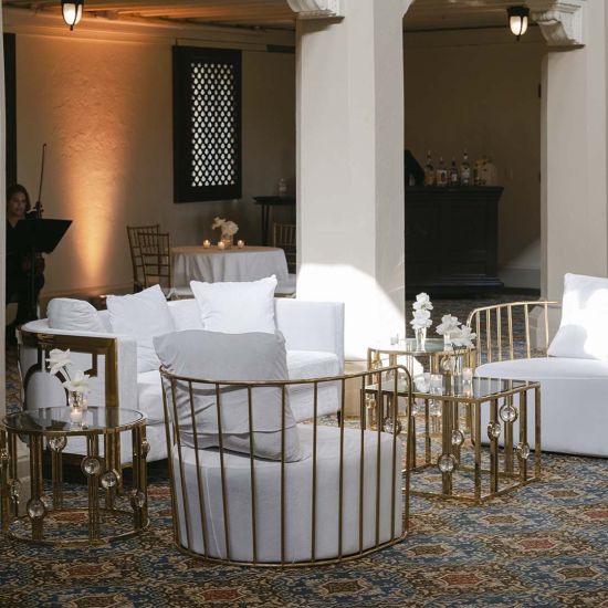 Gold  cushioned Reflection accent chair with gold bar frame, modern luxury lounge seating for weddings and upscale events.