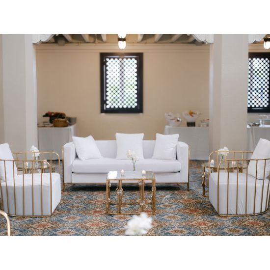 Gold  cushioned Reflection accent chair with gold bar frame, modern luxury lounge seating for weddings and upscale events.